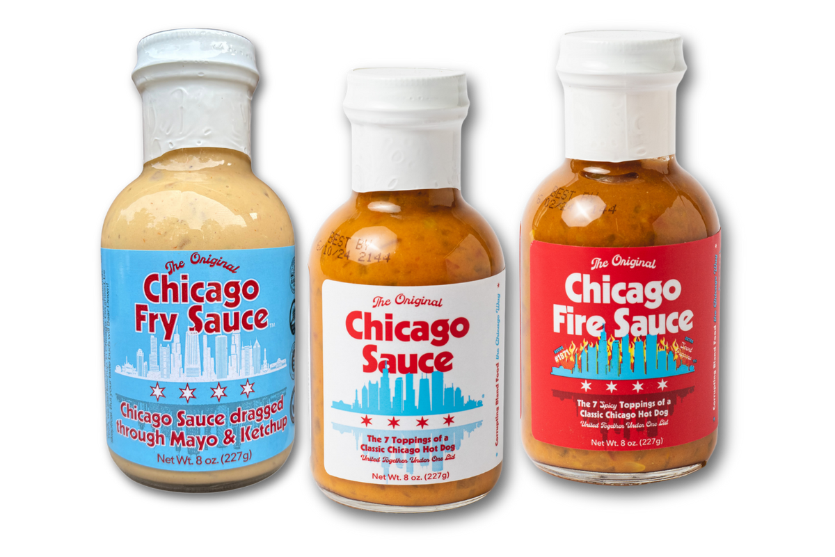 Three bottles of Chicago Original sauce on a plain white background: Chicago Fry Sauce with a blue label, Chicago Sauce with a white label, and Chicago Fire Sauce with a red label.